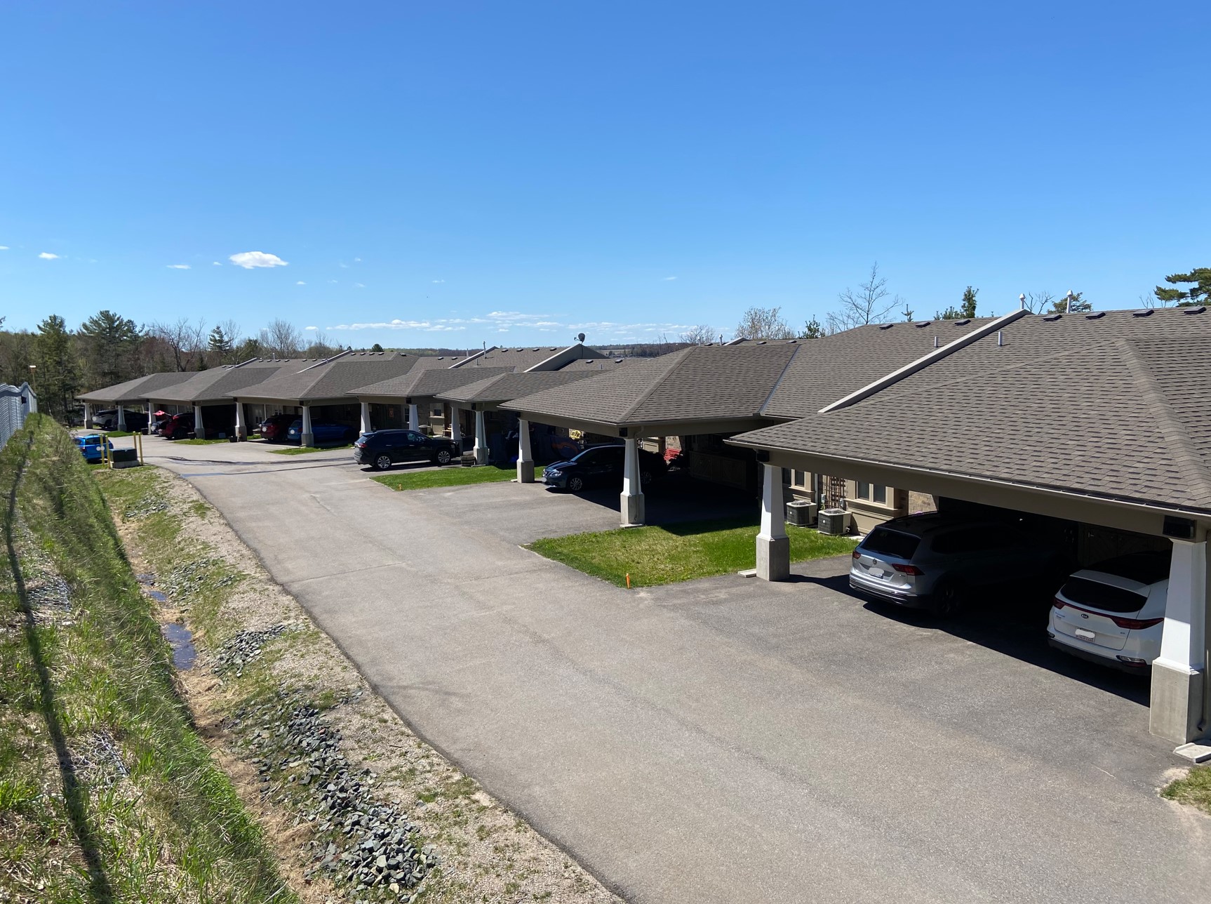 Richards Landing Senior Complex. A picture of Richards Landing Senior Complex where you can see numerous apartments and their carports.